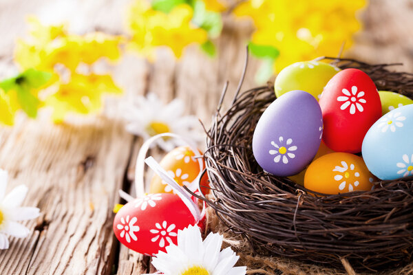 Easter colored eggs on wood