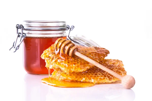 Honey with honeycomb, isolated on white background — Zdjęcie stockowe