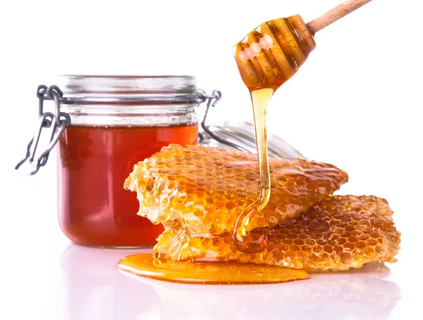 Honey with honeycomb, isolated on white background — Zdjęcie stockowe