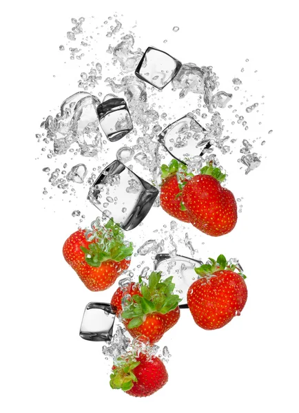 Fresh strawberries falling in water splash — Stock Photo, Image