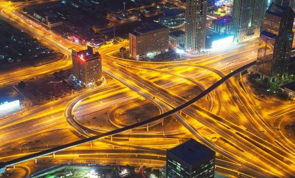 Aerial view of motorway in modern city at night — Stock Photo, Image