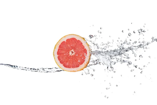 Segment van grapefruit in water splash — Stockfoto