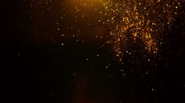 Siyah zemin üzerinde ışıldayan altın parçacıkların süper yavaş çekimi. Sığ odak derinliği. Yüksek hızlı sinema kamerası, 1000 fps..