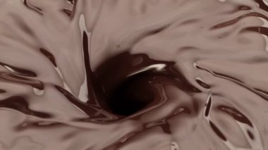Koyu sıcak çikolata hortumunun süper yavaş çekimi. Yüksek hızlı sinema kamerası, 1000fps.