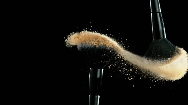 Soft Cosmetics Brushes Releasing Cloud Beige Face Powder Black Background — Stock Photo, Image