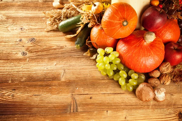 Autumn harvested fruit and vegetable on wood — Stock Photo, Image