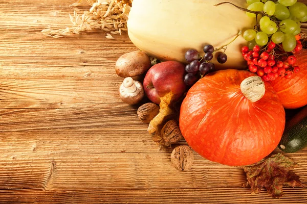 Autumn harvested fruit and vegetable on wood — Stock Photo, Image