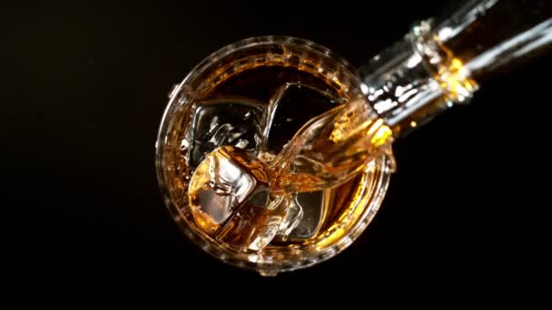 Super Slow Motion Pouring Whiskey Glass Top View Shot Filmed — Stock Video