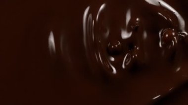Süzülen siyah çikolatanın süper yavaş akışı. Yüksek hızlı sinema kamerası, 1000fps.