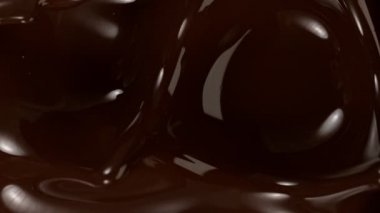 Süzülen siyah çikolatanın süper yavaş akışı. Yüksek hızlı sinema kamerası, 1000fps.
