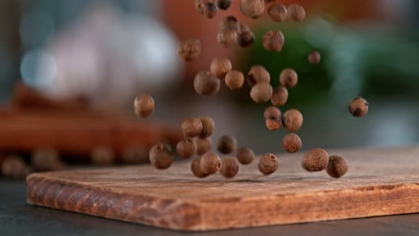 Super Slow Motion Falling Allspice Balls Wooden Board Filmed High — Vídeos de Stock