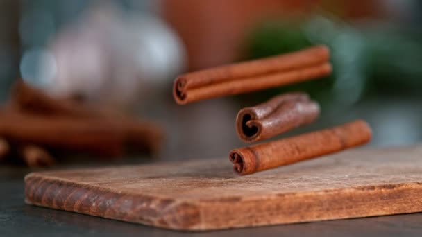 Super Slow Motion Falling Cinnamon Spice Wooden Board Filmed High — Stock Video