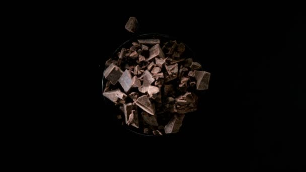 Super Slow Motion Rotating Group Raw Chocolate Pieces Black Background — Stockvideo