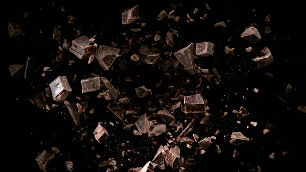 Заморожувати Рух Літаючої Групи Сирих Шматочків Шоколаду Ізольовані Чорному Тлі — стокове фото