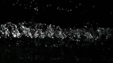 Super slow motion of impact hit of splashing water, close-up. Filmed on high speed cinema camera, 1000 fps.