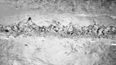 Super slow motion of impact hit of splashing water, close-up. Filmed on high speed cinema camera, 1000 fps.