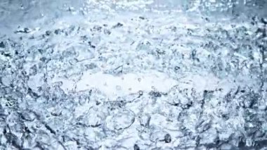 Super slow motion of impact hit of splashing water, close-up. Filmed on high speed cinema camera, 1000 fps.