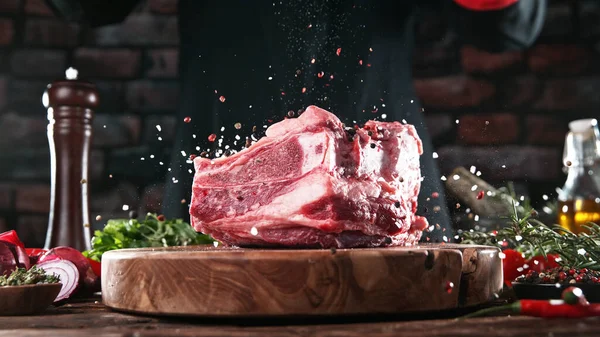 Chef Pouring Grained Salt Pepper Spice Raw Meat Steak Placed — Stock Photo, Image