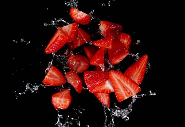 Freeze Motion Sliced Strawberries Water Splash Isolated Black Background — Stock Photo, Image