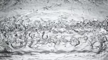 Super slow motion of impact hit of splashing water, close-up. Filmed on high speed cinema camera, 1000 fps.
