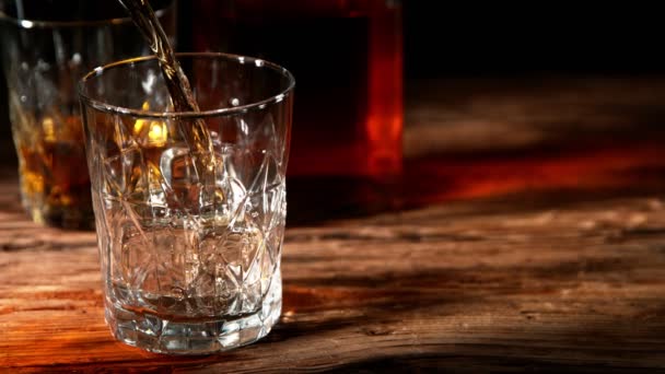 Super Slow Motion Pouring Whiskey Glass Placed Old Wooden Table — Vídeos de Stock