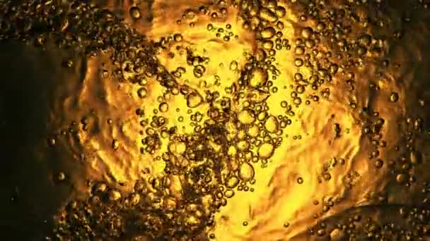 Super Slow Motion Bubbling Whiskey Cognac Oil Surface Filmed High — Vídeos de Stock