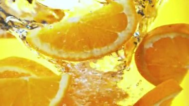 Super slow motion of rotating orange slices underwater. Filmed on high speed cinema camera, 1000 fps. Speed ramp effect.