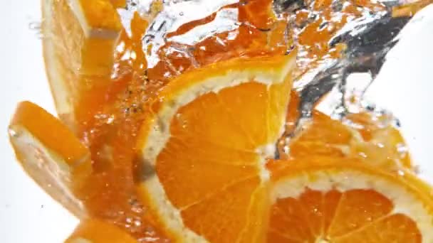 Super Slow Motion Rotating Orange Slices Underwater Filmed High Speed — Stock Video