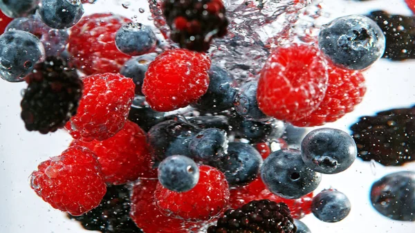 Close Various Kind Berries Water Isolated White Background — kuvapankkivalokuva