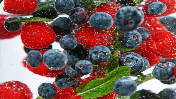 Close Various Kind Berries Water Isolated White Background — kuvapankkivalokuva