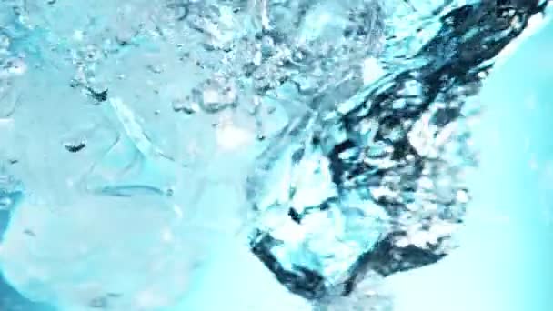 Super Slow Motion Rotating Ice Cubes Water Filmed High Speed — Wideo stockowe