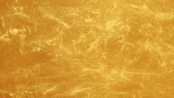 Σούπερ Αργή Κίνηση Λαμπερά Χρυσά Σωματίδια Στο Νερό Αφηρημένο Στυλ — Αρχείο Βίντεο