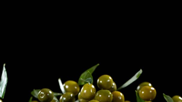 Super Slow Motion Flying Green Olives Black Background Filmed High — ストック動画