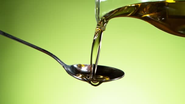 Super Slow Motion Pouring Oil Olives Spoon Filmed High Speed — Stock Video