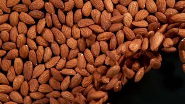 Super Slow Motion Blowing Almonds Black Background Filmed High Speed — Stock Video
