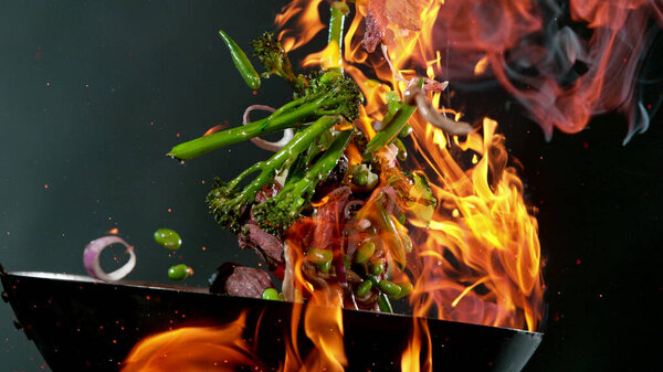 Closeup Chef Throwing Beef Pieces Vegetable Wok Pan Fire Fresh Stock Image