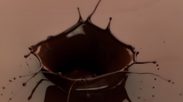 Super Slow Motion Splashing Dark Hot Melted Chocolate Crown Shape — Stockvideo