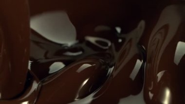 Super Slow Motion of Pouring Chocolate into Melted Chocolate, Splashing. Filmed with High Speed Cinema Camera, 1000fps.