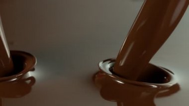 Erimiş çikolatanın Süper Yavaş Dökümü. Yüksek Hız Sinema Kamerası, 1000fps.