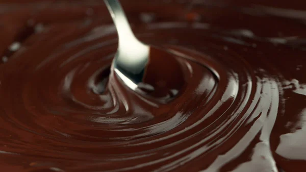 Close Stirring Stream Melted Chocolate Creating Smooth Shapes — Stockfoto