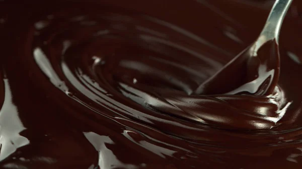 Close Stirring Stream Melted Chocolate Creating Smooth Shapes — Stockfoto