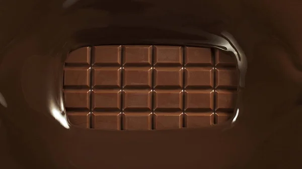 Chocolate bar with chocolate splashing around. Freeze motion of whole chocolate bar, top view.