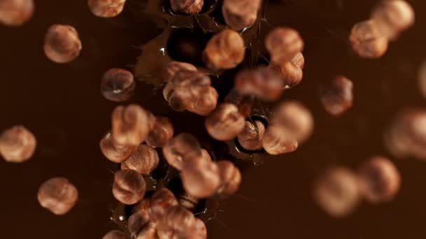 Super Slow Motion Falling Hazelnuts Melted Chocolate Filmed High Speed — Vídeo de Stock