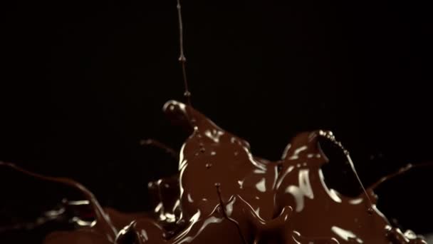 Super Slow Motion Melted Chocolate Splashing Waves Shapes Isolated Black — Vídeos de Stock