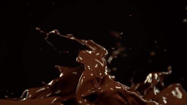 Super Slow Motion Melted Chocolate Splashing Waves Shapes Isolated Black — Video Stock