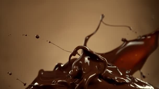 Super Slow Motion Melted Chocolate Splashing Waves Shapes Isolated Brown — ストック動画