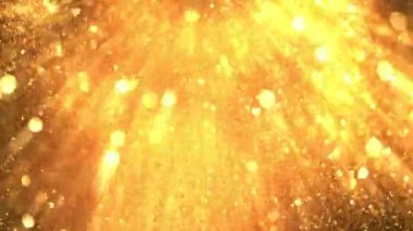Super slow motion of glittering golden particles on black background. Shallow depth of focus. Abstract shimmering background with glows.