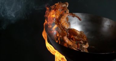 Super slow motion of flying whole prawns from wok pan. Filmed on high speed cinema camera, 1000 fps.