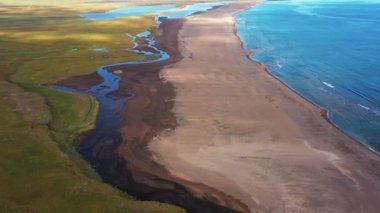 Aerial panoramic footage of Icelandic landscape. Smooth drone footage of beautiful seaside and coastline landscape in Iceland.