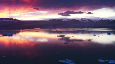 Aerial panoramic footage of sunset above Jkulsrln glacier. Beautiful sunset landscape with horizon.